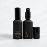 Two Mila Mae & Co French Pear room spray bottles, one with its cap off